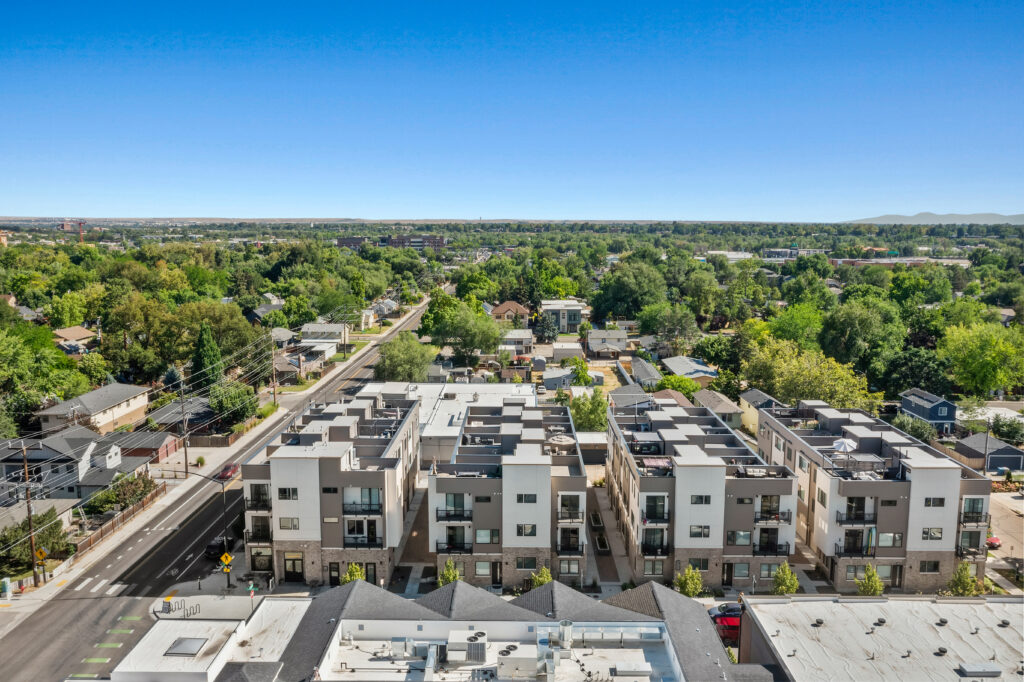 Aerial Overview of Townhome Community - Good News Realty Group Aerial view showing townhomes and neighborhood