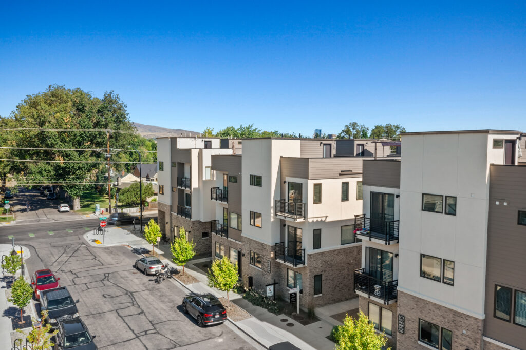 Corner View of Townhomes - Good News Realty Group Street-level photo of multi-story modern townhomes